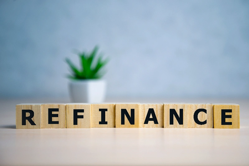 Focus on wooden blocks with letter refinance